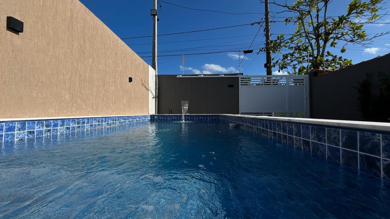 CASA NOVA EM ALTO PADRAO COM PISCINA E 02 DORMITORIOS NA PRAIA